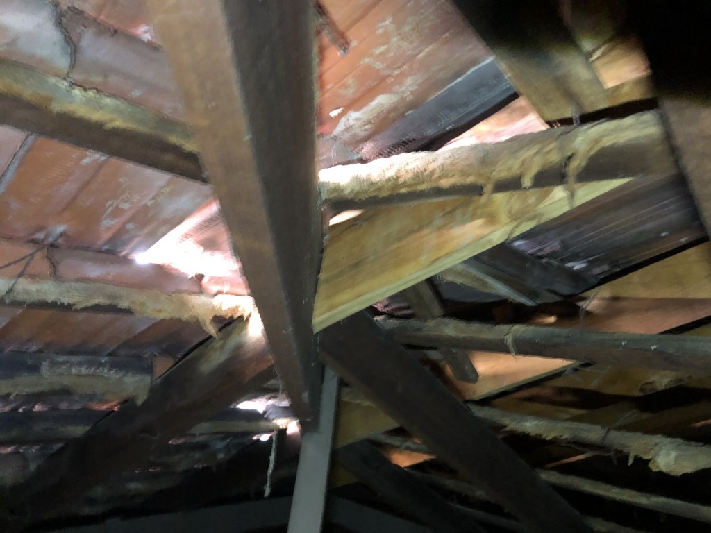 Damaged and broken timber rafters do not provide sufficient support for the weight of the roof tiles