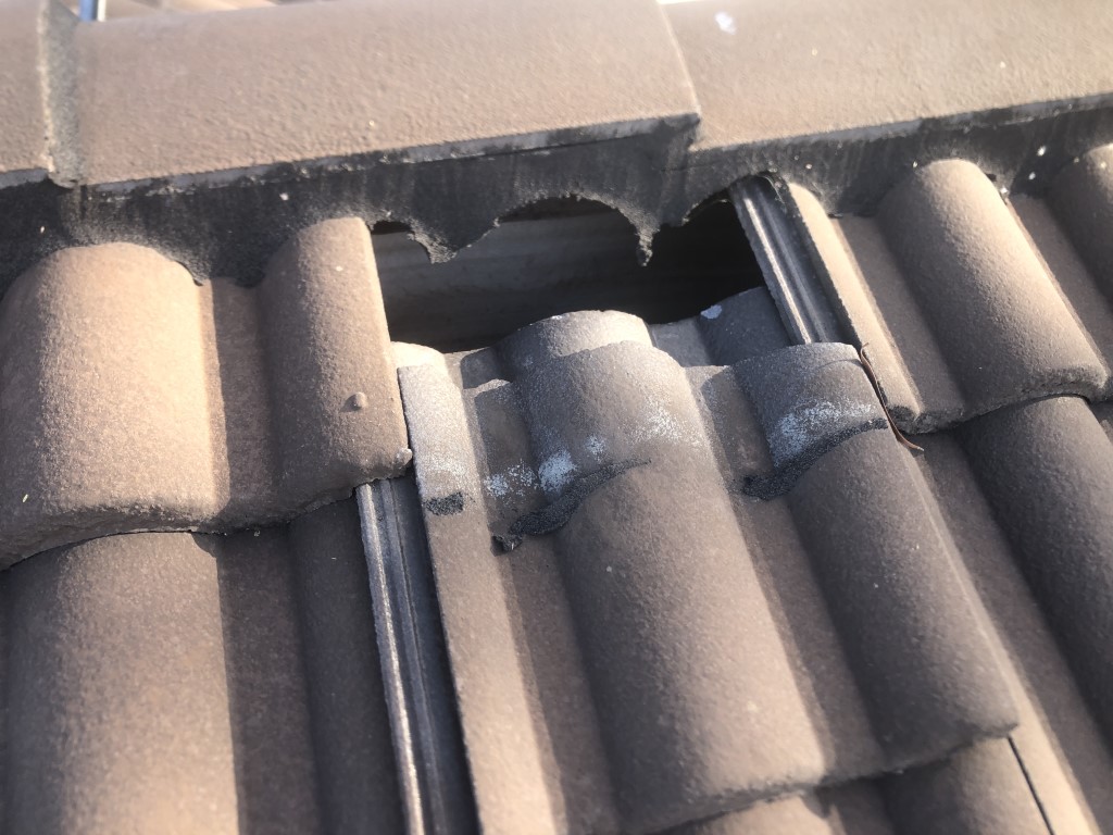 Slipped roof tile near ridge