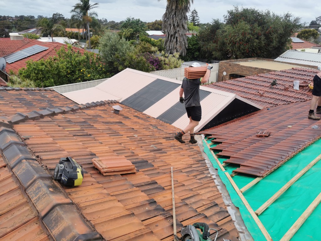 Carrying roof tiles onto roof